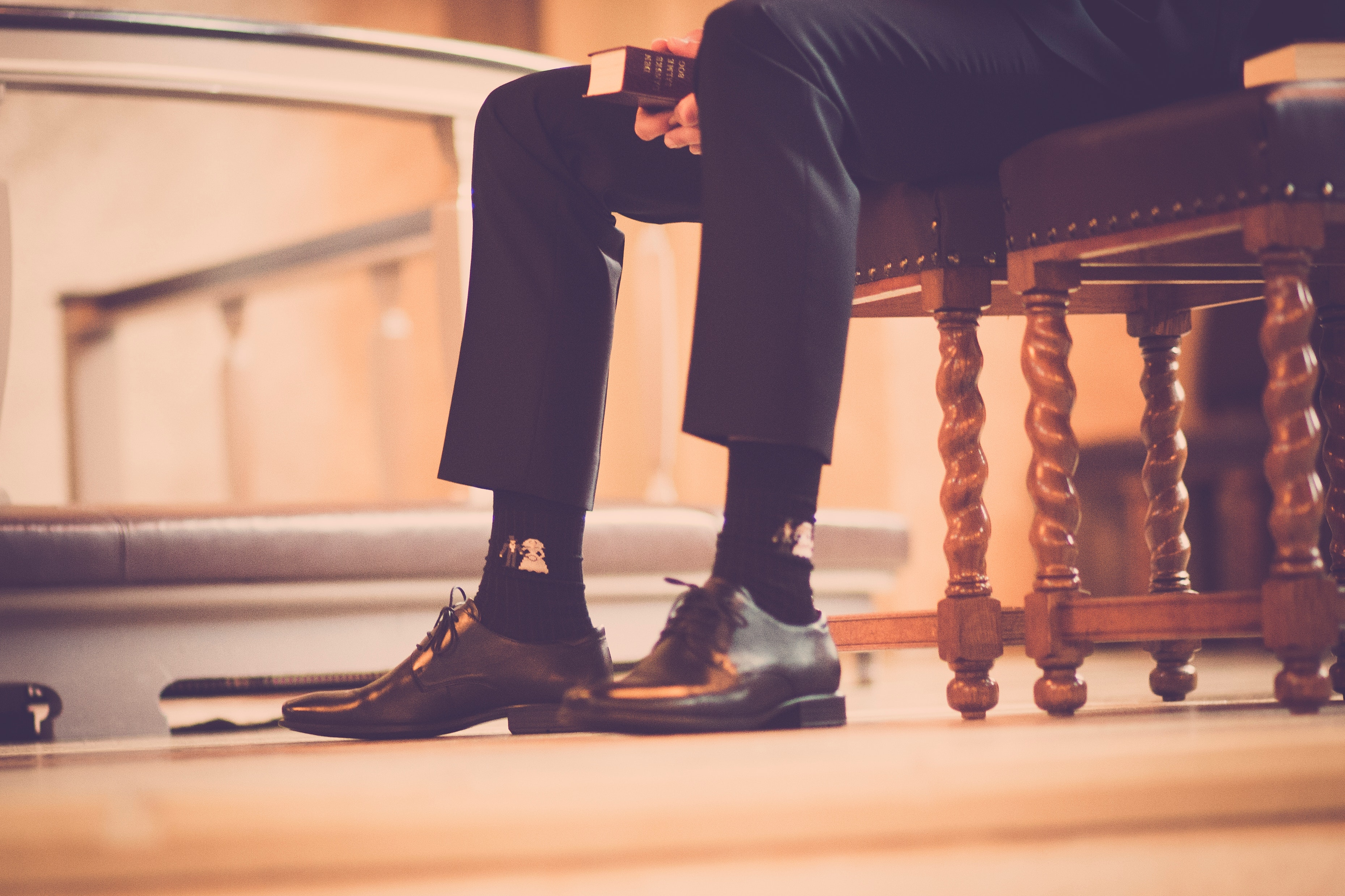 person-sitting-on-a-chair-holding-book-636010